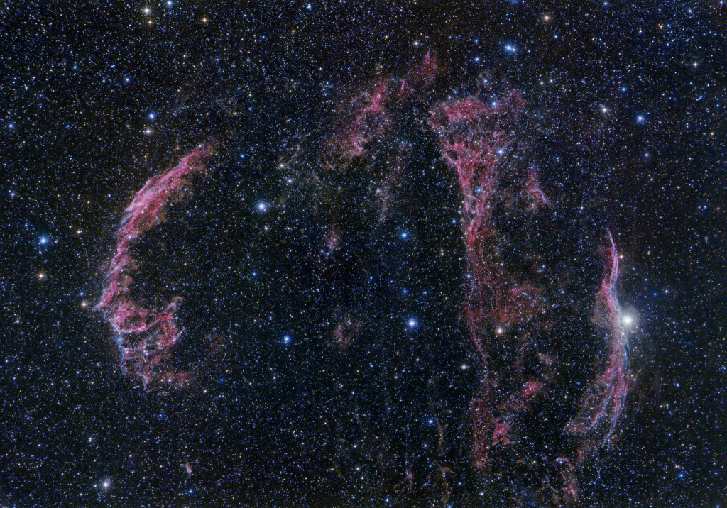 The Veil Nebula supernova remnant. The brighter eastern section of the Veil (NGC 6992) is at left. The fainter western section at right (NGC 6960) overlaps with the star 52 Cygni. The fainter section called "Pickering's Triangle is between the two. Credit: Terry Hancock, Downunderobservatory.com