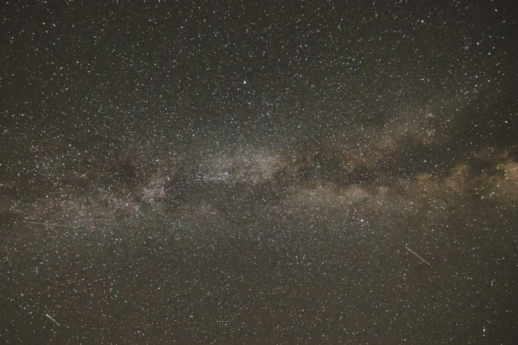 The Milky Way through the constellation Cygnus. The dark cloud bisecting the Milky Way is the Great Rift.